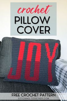 a crochet pillow cover with the words joy written on it in red and grey