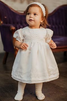 Classic Short Sleeve Dress For Baptism, Short Sleeve First Communion Dress, Classic First Communion Dress With Lace Trim For Baptism, Elegant Fitted Baptism Dress For Church, Classic First Communion Dress With Lace Trim, Classic Baptism Dress With Lace Trim, Classic White Baptism Dress For Church, Cream Baptism Dress With Fitted Bodice, Classic White Baptism Dress With Fitted Bodice