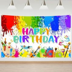 an image of a happy birthday banner with paint splattered on the wall behind it