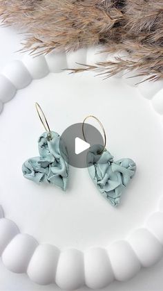 the earrings are made out of polymer and have been folded together to make them look like they