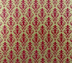 a red and beige wallpaper with an intricate design on the bottom half of it