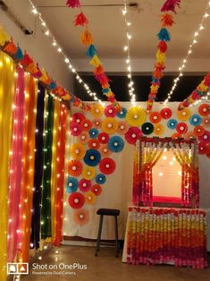 a room decorated with colorful decorations and lights