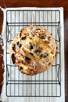 a loaf of bread sitting on top of a cooling rack