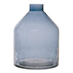 a blue glass bottle is shown against a white background