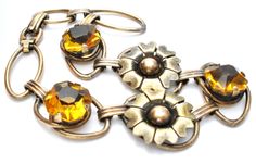 Antique Bracelet - This is a 12K gold filled over sterling silver citrine rhinestones flower bracelet. It is signed PR. ST. CO for Providence Stock Co., hallmarked 1/20 12K on Sterling, 6.25" long, slightly over .5" wide, weighs 8.6 grams. Art Deco Flower, Antique Bracelets, Rhinestone Bracelet, Flower Bracelet, Citrine, Gold Filled, Gold Bracelet, Art Deco, Bracelet