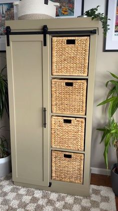 an armoire with four wicker baskets on the front and three drawers in the back