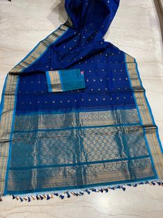 Gadwal sari is a handcrafted woven sari style in Gadwal of Jogulamba Gadwal district in the Indian state of Telangana. They are most notable for the Zari on the saris. The sari consists of cotton and silk thread woven body with silk pallu which is also given a new name as Sico saris. The saree is traditionally woven in the interlocked-weft technique, called Kupadam or Kuttu. This saree is unique in colour combination. If you want can make the blouse also with extra charges . In Case of stitching Diwali Handloom Pre-draped Saree In Traditional Drape, Traditional Blue Handloom Pre-draped Saree, Handloom Pre-draped Saree For Puja And Eid, Handloom Pre-draped Saree For Eid Puja, Blue Traditional Wear With Weaving Work For Ceremonies, Diwali Paithani Silk Handloom Dupatta, Diwali Handloom Paithani Silk Dupatta, Diwali Handloom Katan Silk Pre-draped Saree, Traditional Blue Salwar Kameez For Puja