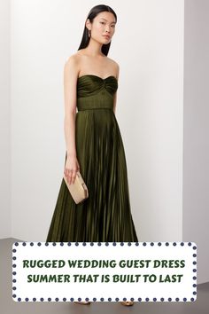 a woman in a green dress with the words rugged wedding guest dress summer that is built to last