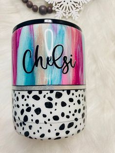 a colorful can with the word cheesi painted on it