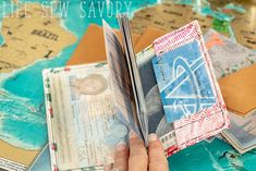 a person holding an open passport on top of a map with the words life sew savory