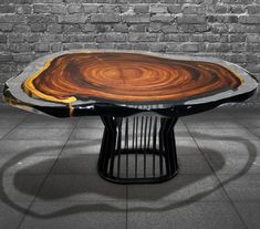 a table that has been designed to look like a tree stump with an interesting design on it