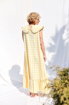 Maxi dress made in a yellow seersucker check print fabric. Loose and extremely comfortable fit, can be worn with or without a matching fabric tie belt. Elegant and feminine look. • Handmade in our studio • A-line silhouette • Sleeveless bodice • Matching fabric tie belt • Puritan collar with ruffled details • Button loop closure on the back • Hidden side seam pockets • Available from XXS to XXL size or can be made in a custom size Yellow Sleeveless Sundress For Picnic, Yellow Cotton Dress For Picnic, Sleeveless Gingham Dresses For Daywear, Yellow Linen Dress, Puritan Collar, Bib Dress, Sleeveless Summer Dress, Make Your Own Clothes, Big Collar