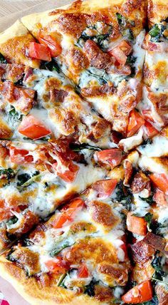 a pizza sitting on top of a pan covered in cheese and veggie toppings