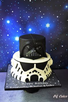 a darth vader birthday cake with stars in the background