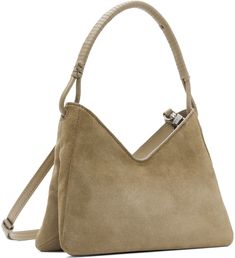 Suede shoulder bag in taupe. · Knotted detailing at hand-wrapped fixed carry handle · Adjustable and detachable crossbody strap · Logo embossed at back face · Zip closure · Patch pocket at interior · Moiré lining · H7x W10 x D4 Supplier color: Dune Designer Taupe Top Handle Shoulder Bag, Modern Staud Shoulder Bag With Handle Drop, Luxury Taupe Shoulder Bag With Top Carry Handle, Luxury Taupe Shoulder Bag With Top Handle, Staud Double Handle Evening Bag, Elegant Staud Double Handle Bag, Elegant Staud Double Handle Bags, Modern Taupe Bags, Designer Taupe Bag With Detachable Handle