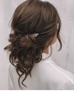 a woman with her hair in a half updo