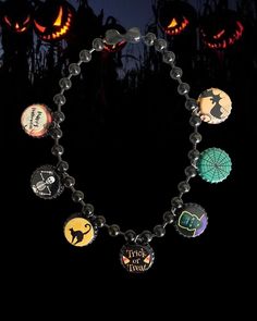 a bracelet with halloween themed buttons on it