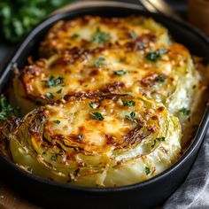 some food is in a black pan on a table