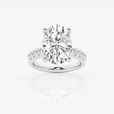 a round cut diamond ring with pave set shoulders