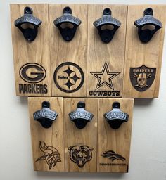 several nfl bottle openers mounted to a wall