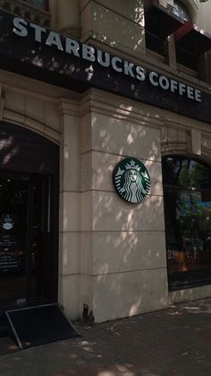 starbucks sign on the side of a building