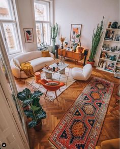 the instagram page shows an image of a living room with couches and rugs