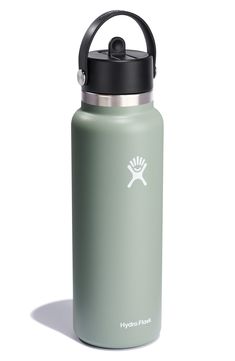 the hydro flask water bottle is green and has a black lid with a white logo on it