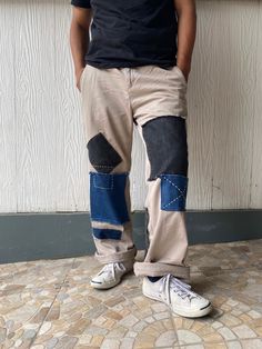 "Description: Uniqueness is here for those who love‼️ It's originally chino pants in plain khaki which 3 - 4 different tone colors of denim were patched on the front and back of the pants as photos shown. The work has completely done by both machine and hand sewing stitches in order to make it unique and perfect combination.  Photos describes the product better. So, just have a look-see at them all and read the special features below before you decide to purchase it.  Features: - Patchwork chino pants. -  3 - 4 different tone colors of denim were patched on the front and back of the pants - Frayed jeans were also used as detailing.  - Two side pockets and two rare pockets + one patched denim pocket. - Relaxed fit. - It's originally made in Maldives. Size: Waist: 34 - 35\" (Round) Hips:  40 Casual Beige Patchwork Pants, Relaxed Fit Denim Blue Patchwork Bottoms, Baggy Patchwork Cotton Jeans, Baggy Cotton Patchwork Jeans, Dark Wash Cotton Bottoms With Contrast Stitching, Relaxed Fit Denim Bottoms With Patchwork, Relaxed Fit Denim Patchwork Bottoms, Denim Blue Cotton Patchwork Bottoms, Relaxed Fit Denim Blue Patchwork Pants