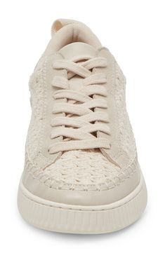 A durable woven upper with boldly whipstitched trim and buttery leather accents lends artisanal flair to a wear-anywhere sneaker. Lace-up style Textile and leather upper/textile lining/rubber sole Imported Neutral Lace-up Sneakers With Rubber Sole, Neutral Leather Lace-up Sneakers, Dolce Vita Notice Sneakers, Beige Textured Lace-up Sneakers, Dolce Vita Sneakers, Leather Accents, Up Styles, Womens Sneakers, Rubber Sole