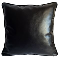 a black leather pillow on a white background