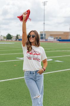 Designed for the ultimate Georgia Bulldog fan, this cream graphic tee is a must-have addition to your wardrobe. Made from 100% cotton, the short sleeve tee features a bold football helmet graphic and "The Bulldogs Rock The Who" text. With a relaxed fit and round neckline, it's the perfect option for game day or everyday wear. Simply style it with your favorite denim jeans and sneakers to complete the look. Cream Graphic Tee, Bright Colors Fashion, Georgia Bulldog, Shopping Games, Gameday Dress, Casual White Dress, Power Dressing, Football Helmet, The Who