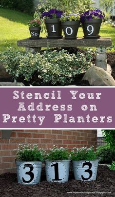 several pots with flowers and numbers on them in front of a brick building, the words stencil your address on pretty planters