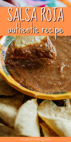 salsa roja authentic recipe with tortilla chips in the foreground and text overlay that reads salsa roja authentic recipe