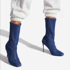 A Mid-Calf Bootie With A Stiletto Heel And Pull-On Construction. Material: Textile Features: Sd Dream Sole Double The Padding For Comfort, Support, And Ease Of Movement Outside Heel Height: 4" Shaft Height: 9" Spring Stretch High Heel Boots, Casual Stretch Ankle-high Boots, Trendy Ankle-high Fitted Heels, Casual Blue Heeled Boots For Winter, Casual Blue High Heeled Boots, Casual Blue Heels For Winter, Trendy Stretch Boots With Round Toe, Casual Stretch Boots With Round Toe, Fitted Casual Boots With Pointed Toe