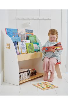 This sturdy and practical bookcase and storage unit features a little wren coat hook on the side. It's perfect for displaying and storing all your little one's colourful picture books and can be affixed to the wall for extra safety. Ages 3 and up 31.89" x 11.61" x 30.39" 24.82 lb. Rubber wood Spot clean Imported Forest Book, Book Week Costume, Walks In London, Wooden Books, Costumes For Sale, Book Case, Picture Books, Coat Hooks, Red Riding Hood