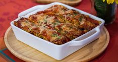 a square casserole dish on a wooden plate