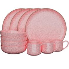 a set of pink dinnerware on a white background