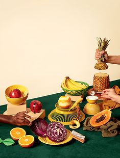 several people are decorating various fruits and vegetables