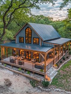 an aerial view of a large house with lots of windows and decking on it