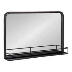 a black metal shelf with a mirror on it