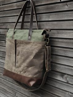 The material I used to make this bag is an American heavy weight waxed canvas. The color is olive for the body, outside pocket in oak brown on one side. The large outside pocket is made in olive waxed canvas on the other side I made it into an everyday bag, ideal to use as diaper bag or weekend bag, because of the many pockets with vegetable tanned leather handles and oiled leather bottom. Closing with a zipper. You can carry this bag in your hand, on your shoulder, or cross body with the adjust Waxed Canvas Tote Shoulder Bag With Waxed Finish, Outdoor Waxed Finish Tote Shoulder Bag, Brown Waxed Canvas Bag, Outdoor Waxed Canvas Satchel With Leather Handles, Khaki Waxed Canvas Bag With Adjustable Strap, Khaki Waxed Canvas Satchel Bag, Outdoor Green Waxed Canvas Shoulder Bag, Outdoor Waxed Canvas Tote Satchel, Outdoor Waxed Canvas Satchel Tote