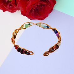 One of a kind Boho Gemstone Rainbow Bracelet  - A unique colourful multi gemstone wire wrapped bracelet - handcrafted with heart from the Beaux Artisan Gems by Black Lotus London Collection.  ❤︎ Classic Rainbow-hued multi gem cuff bangle ❤︎ Flexible cuff style for adjustability ❤︎ Dainty 0.25-inch width adorned with assorted gemstones for a bright and bold look Choose from copper (pictured), gold or silver plated wire work - with optional upgrade to 925 Sterling Silver on request for an addition Unique Multi-stone Bangle Bracelets, Adjustable Multicolor Gemstone Bangle, Luxury Multi-stone Gemstone Bangle, Bohemian Multicolor Crystal Bangle Bracelet, Bohemian Multi-stone Bangle, Single Pearl Pendant, Black Lotus, Pink Sapphire Earrings, Rainbow Gemstones