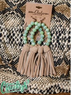 Mint color and camel color tassels, these earrings are about 5 inches long Elegant Brown Adjustable Tassel Earrings, Brown Fringed Tassel Earrings Gift, Brown Fringe Tassel Earrings For Gift, Brown Fringe Tassel Earrings As Gift, Brown Dangle Earrings With Tassels, Bohemian Brown Beaded Tassel Earrings, Chic Adjustable Tassel Earrings, Brown Fringe Tassel Dangle Earrings, Brown Fringe Dangle Tassel Earrings