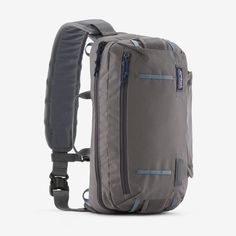 the back pack is grey and has blue trims on the side, while it's attached to an adjustable shoulder strap