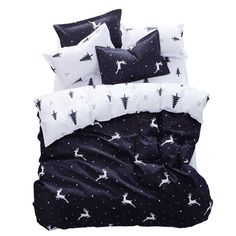 black and white bedding with deers on the pillow cases, pillows and blankets