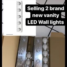 two brand new vanity led wall lights are in the box and one is for sale