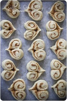 cinnamon buns on a baking sheet ready to be baked in the oven for christmas