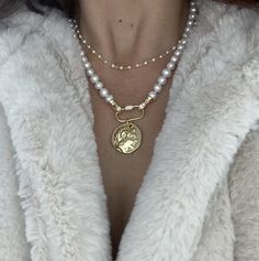 This handmade pearl necklace with large gold coin medallion charm is gorgeous! One of a kind; substantial, an heirloom piece  Pls select coin charm, price remains the same: Lion coin medallion cross coin medallion Greek god coin medallion queen Elizabeth coin medallion So in demand right now! Trending The pearl strand is made with genuine white freshwater potato pearls, measures approx 8mm to 9mm, carefully knotted,  total length includes the lock (pls select), with the carabiner lock.  I finish Gold Medallion Jewelry With Pearl Charm, Gold Coin Necklace With Pearl Chain, Gold Pearl Necklace With Coin Pendant, Gold Medallion Jewelry With Pearl Chain, Carabiner Necklace, Handmade Pearl Necklace, Necklace Cross, Pearl Strand, Star Show