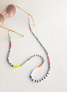 Check out this item in my Etsy shop https://www.etsy.com/listing/796739002/eyeglasses-chain-eyeglass-holder Trendy White Glasses Chains With Colorful Beads, White Glass Glasses Chains With Colorful Beads, Trendy White Glass Necklaces, White Glass Glasses Chains For Fashion Accessory, White Glass Fashion Accessory Glasses Chains, White Glass Glasses Chains, Trendy White Glass Necklace, Eyeglass Holder Necklace, Pulseras Kandi