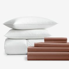 four pillows and three pillowcases stacked on top of each other